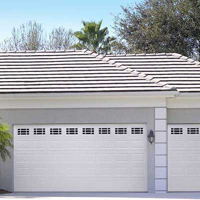 Amarr white traditional garage doors on a home